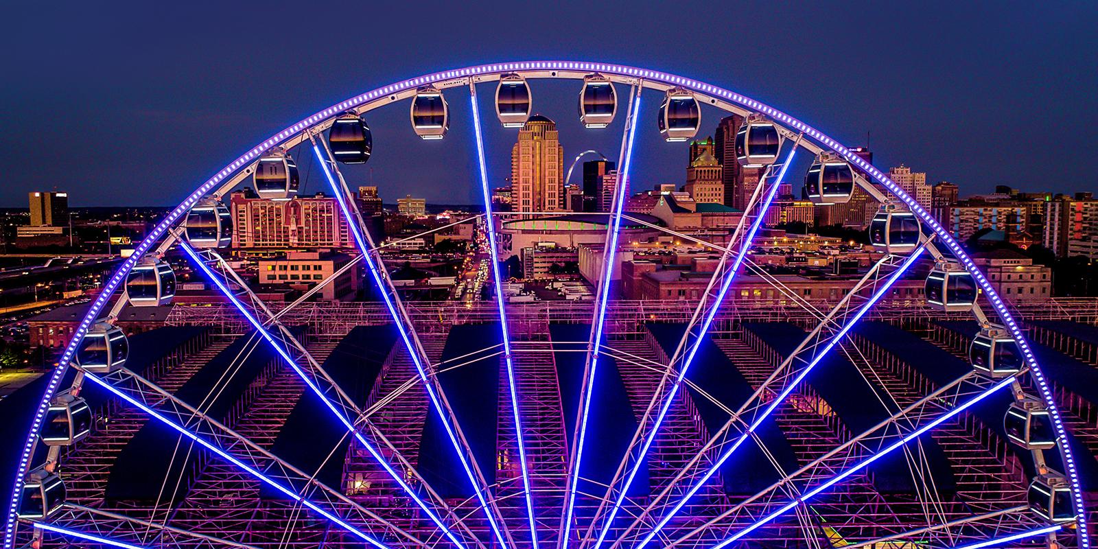 The St. Louis Wheel at Union Station glowing against the nighttime St. Louis skyline.