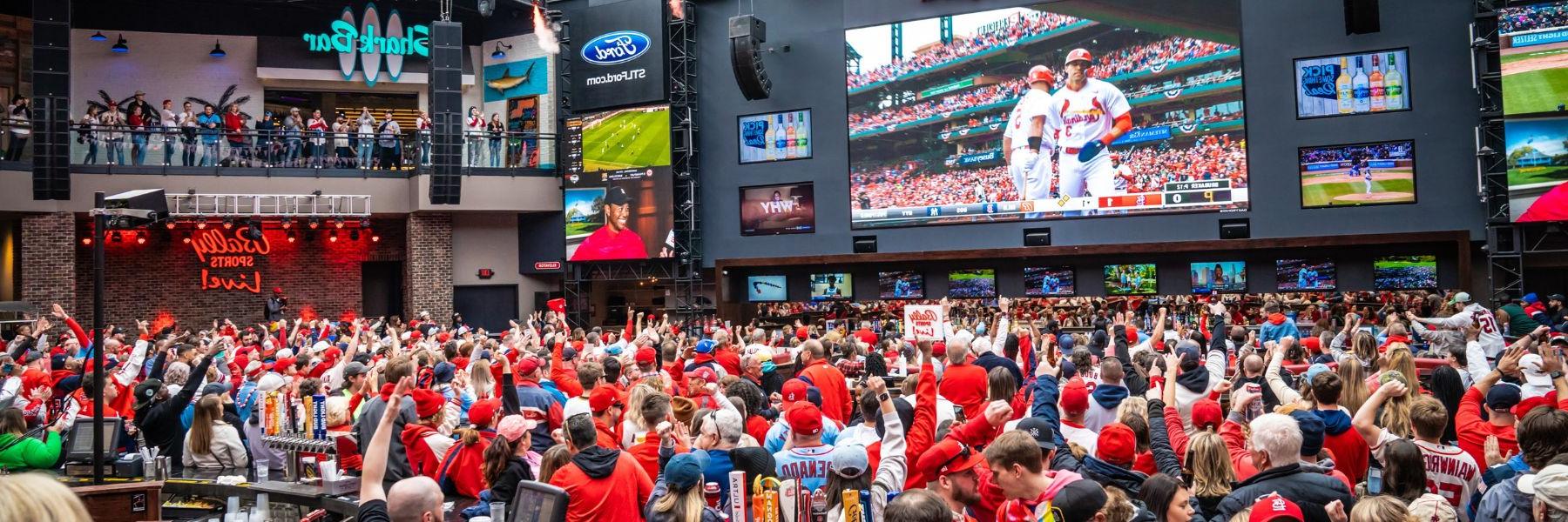 Cardinals fans watch the game on the gigantic screen at Ballpark Village.